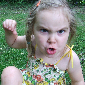 angry little girl about to throw punch