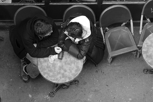 people talking. two people talking at a cafe