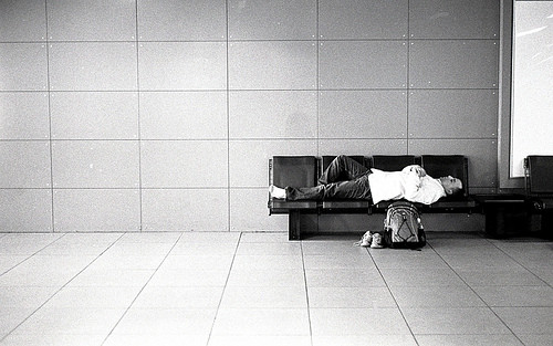 Sleeping in Airport (photo from www.foxnomad.com)